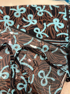 Pochette in batik e pvc con tracollina