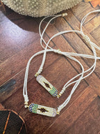 BRACCIALE FILO DI COTONE E PICCOLI ZIRCONI
