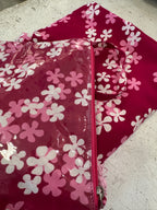 Pochette in batik e pvc con tracollina